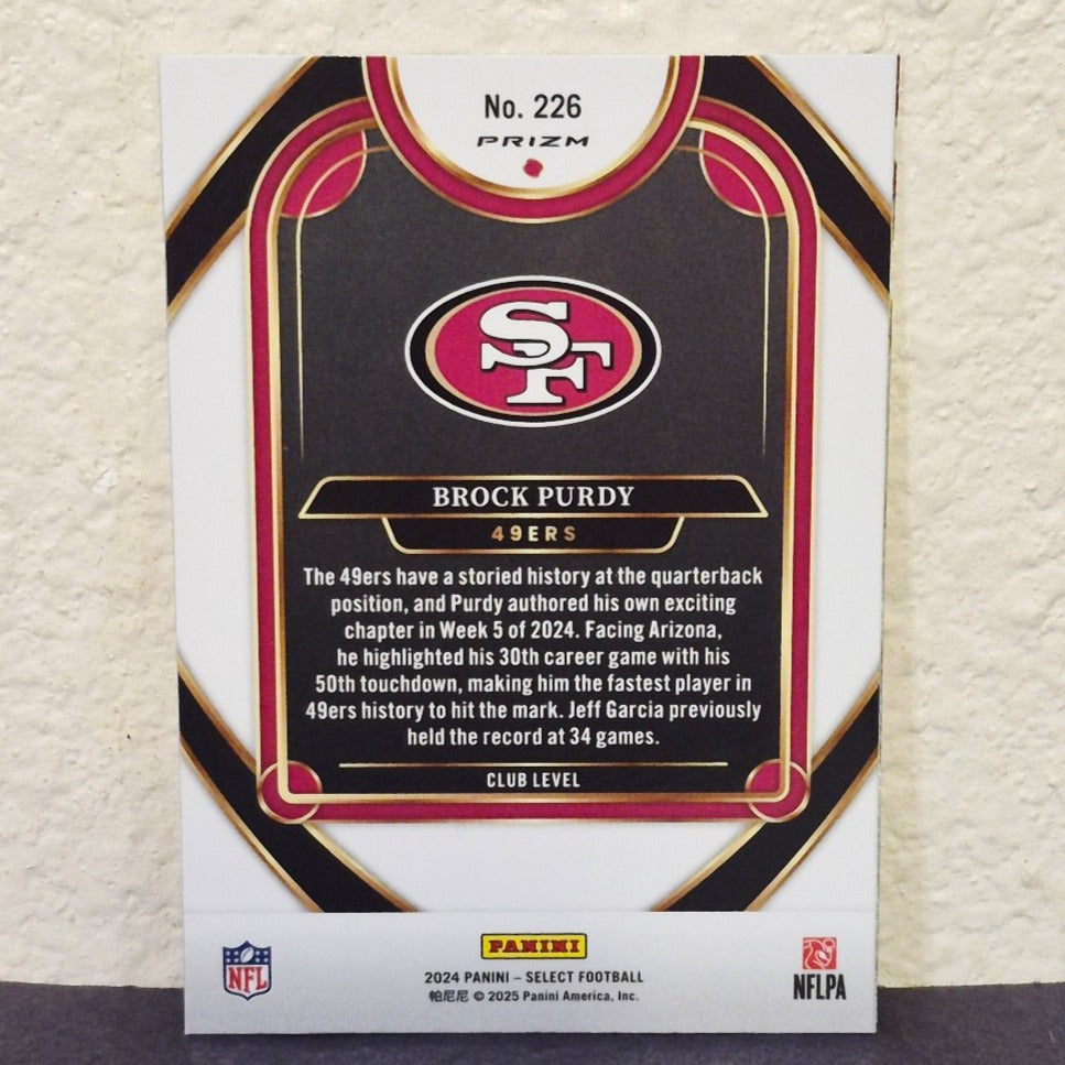 2024 PANINI SELECT BROCK PURDY RED AND YELLOW CLUB LEVEL SHOCK PRIZM #226